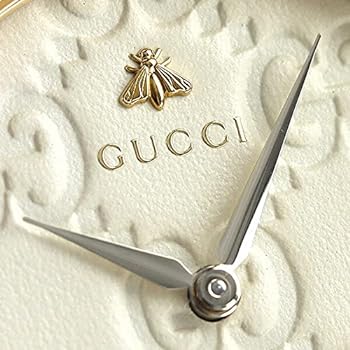 Gucci G-Timeless dial detail white face GG monogram pattern bee logo