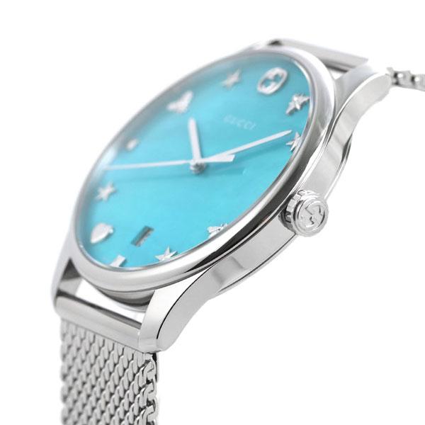 Side view of Gucci G-Timeless watch with turquoise dial and stainless steel case