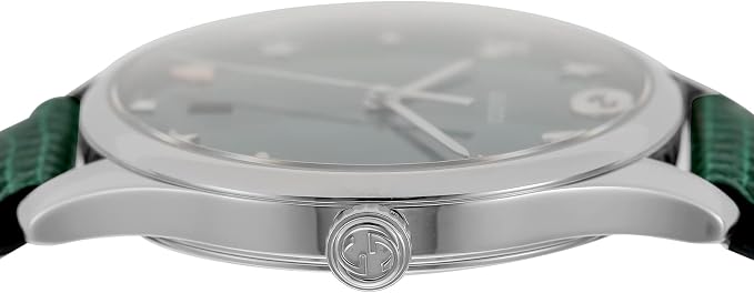 Side view of Gucci G-Timeless watch showing steel case profile and green leather strap