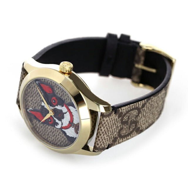 Gucci G Timeless watch worn on wrist showing dial and brown GG monogram strap