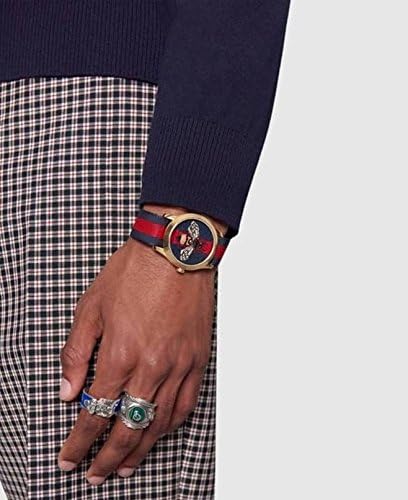 Gucci G-Timeless watch worn on wrist with bee dial visible