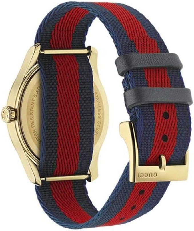 Gucci G-Timeless watch side view showing blue and red striped strap and gold case
