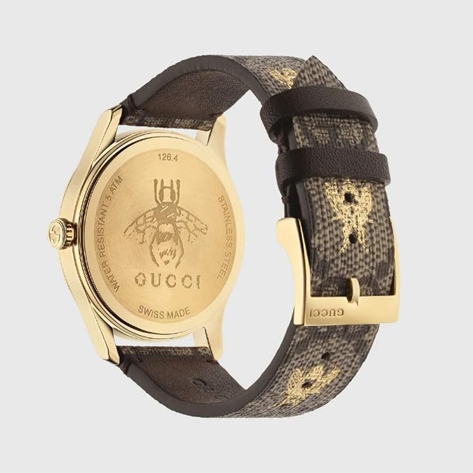 GUCCI G-Timeless watch caseback with engraved bee logo and text, gold-tone case with canvas strap