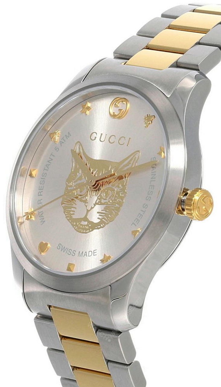Angled view of Gucci G-Timeless two-tone watch showing gold and silver stainless steel bracelet