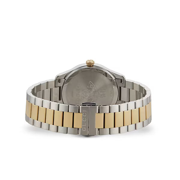 Caseback view of Gucci G-Timeless watch showing two-tone stainless steel bracelet and clasp
