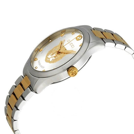 Side profile of Gucci G-Timeless watch with two-tone metal bracelet and gold crown