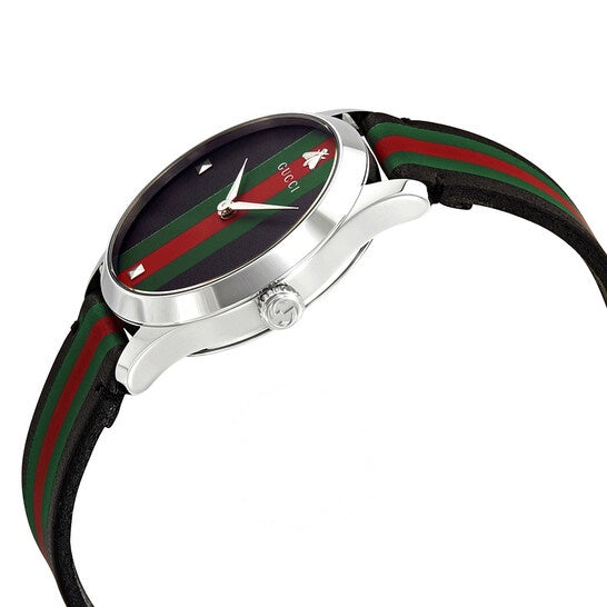 Side angle view of Gucci G-Timeless watch with web stripe strap detail