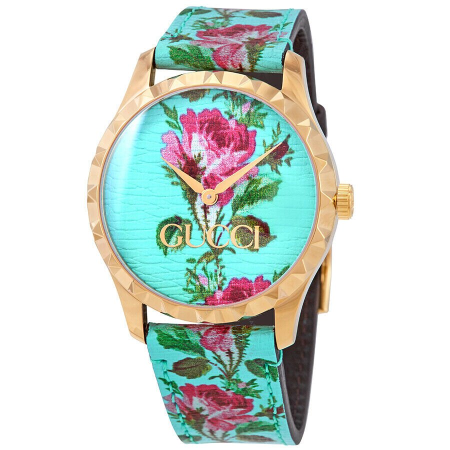 Gucci G-Timeless watch with aqua floral print dial, gold-tone case, and matching leather strap
