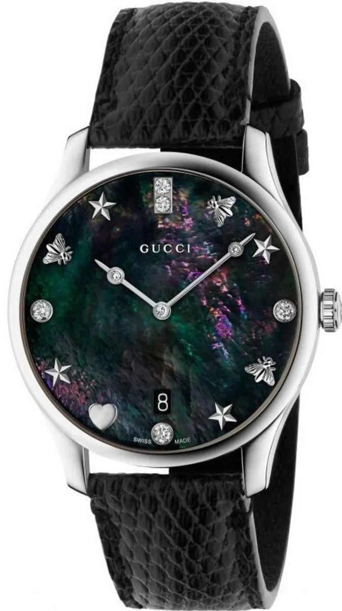 Gucci G-Timeless women's watch with black mother of pearl dial, star and crystal markers, stainless steel case and black leather strap