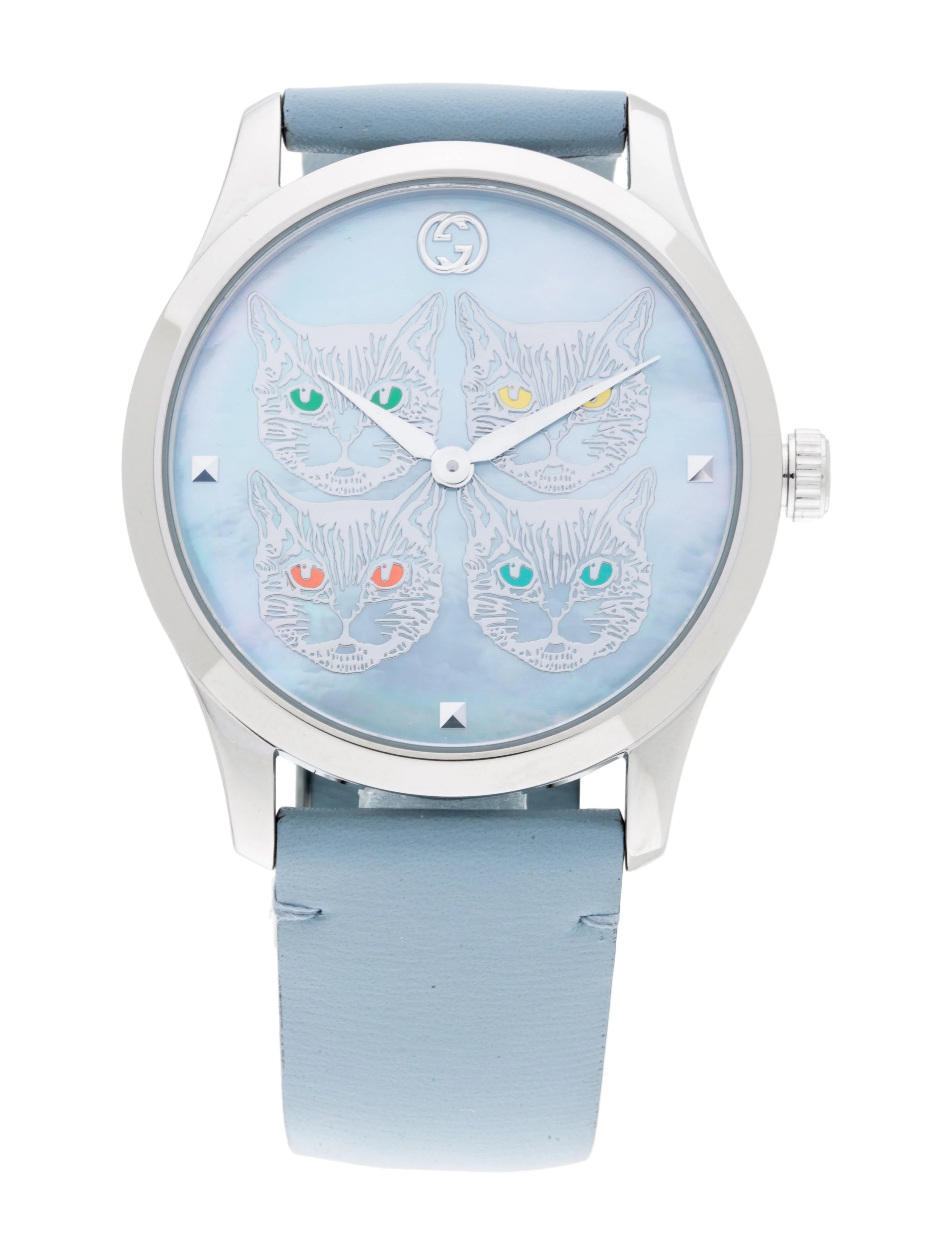 Front view of G-Timeless watch dial with four cat faces and colored crystal eyes