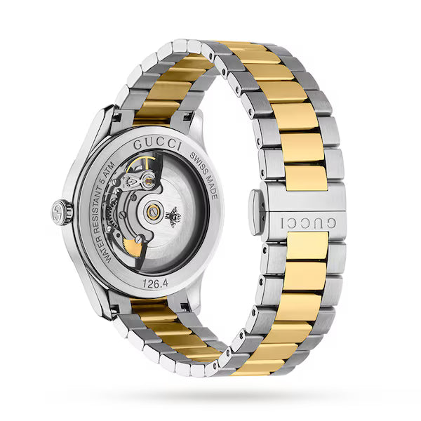 Gucci G-Timeless women's watch with blue dial and two-tone yellow gold and stainless steel bracelet, showing caseback