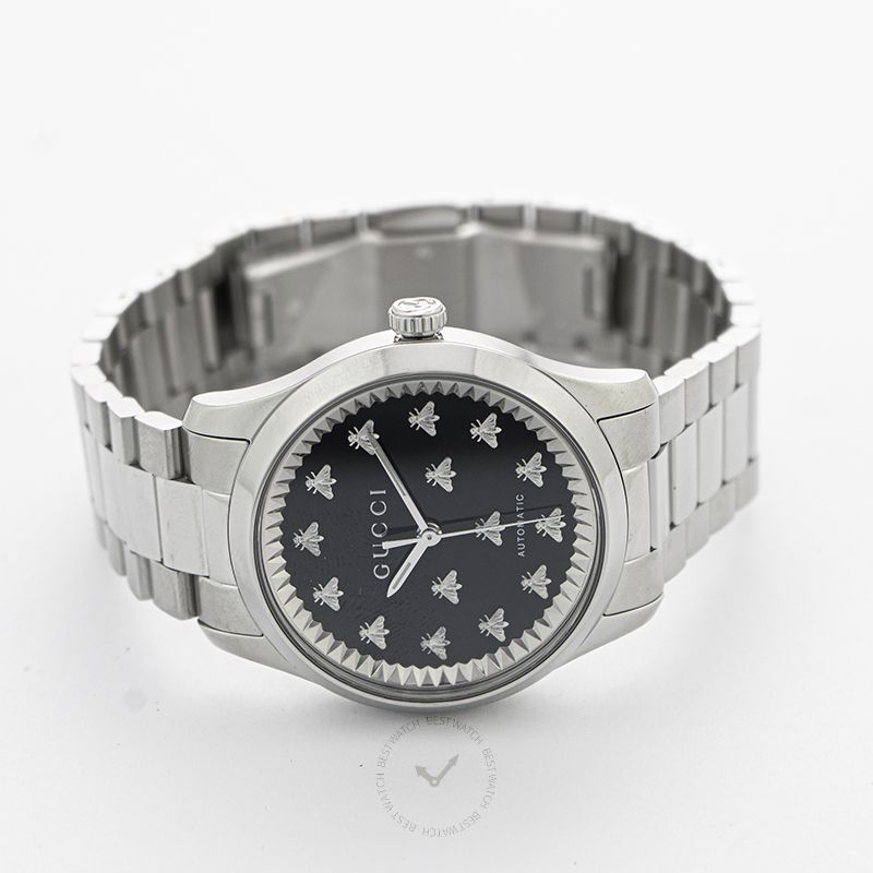 GUCCI G-Timeless 38MM watch three-quarter view showing stainless steel bracelet and black dial