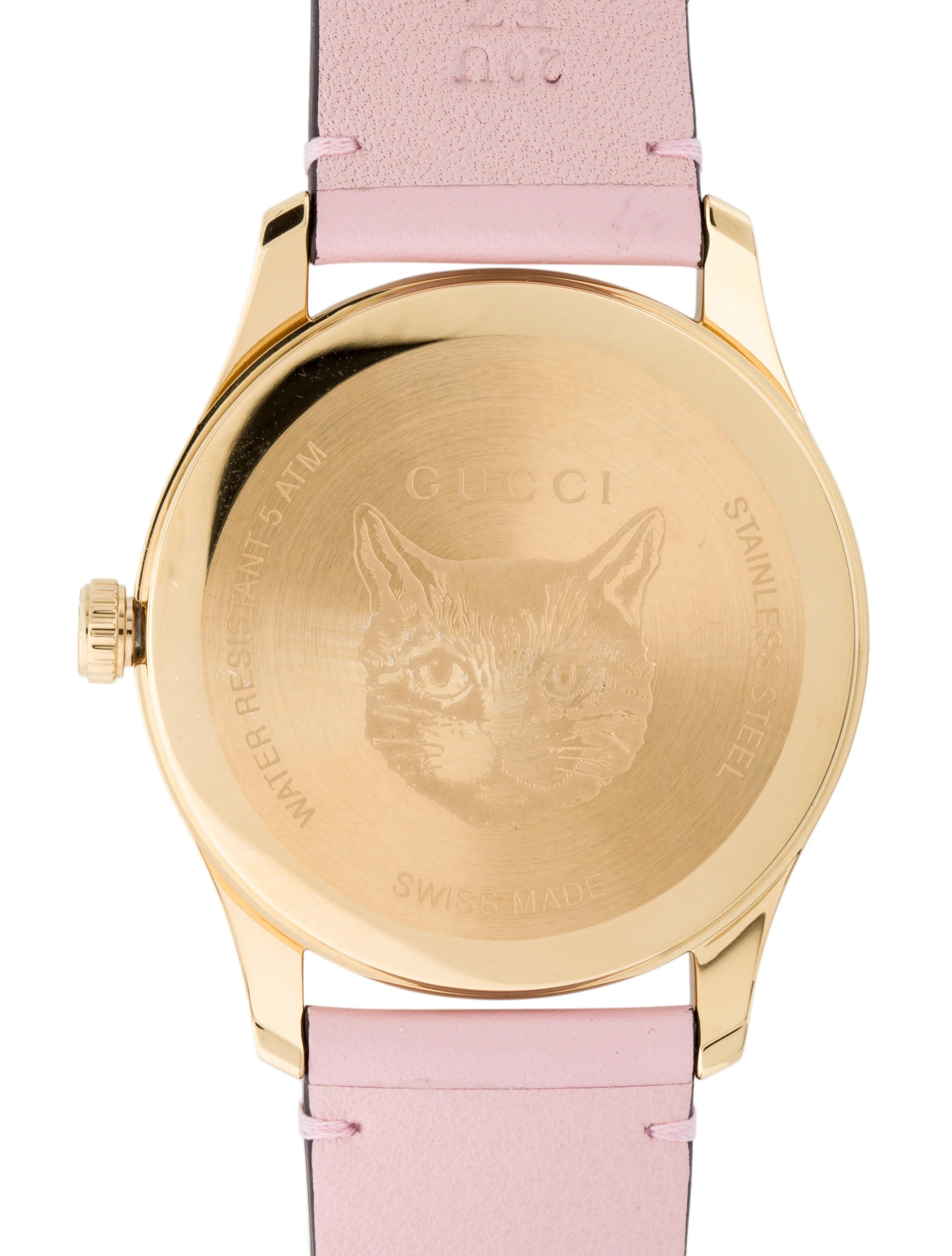Caseback of Gucci G-Timeless watch showing engraved cat face design and Gucci branding