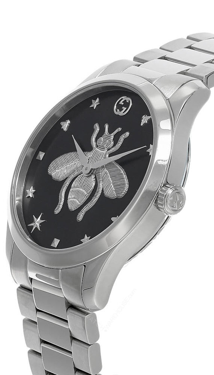 Gucci G-Timeless watch side angle showing bee dial detail and silver steel band