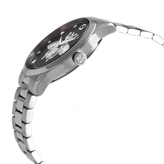 Gucci G-Timeless watch shown from side profile with silver steel bracelet