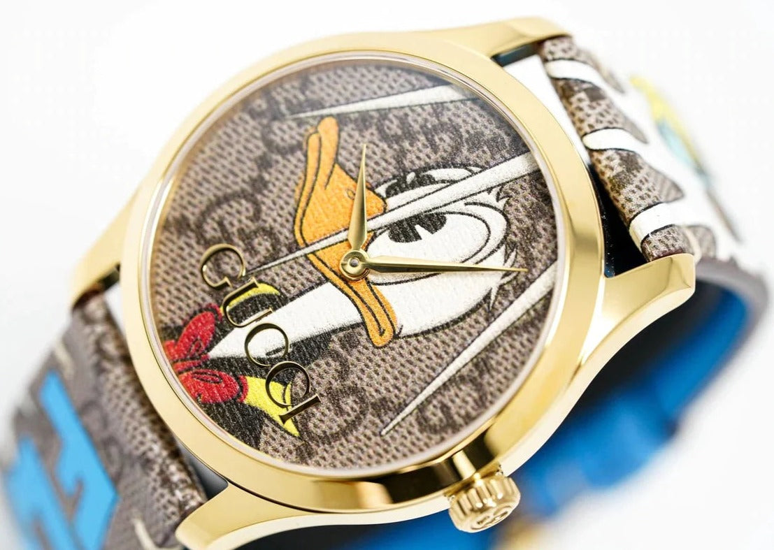 Three-quarter view of Gucci G Timeless YA1264167 watch with dial detail and strap display