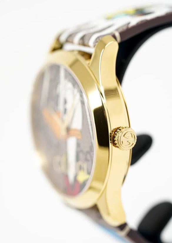 Close-up side view of Gucci G Timeless YA1264167 gold case showing crown detail