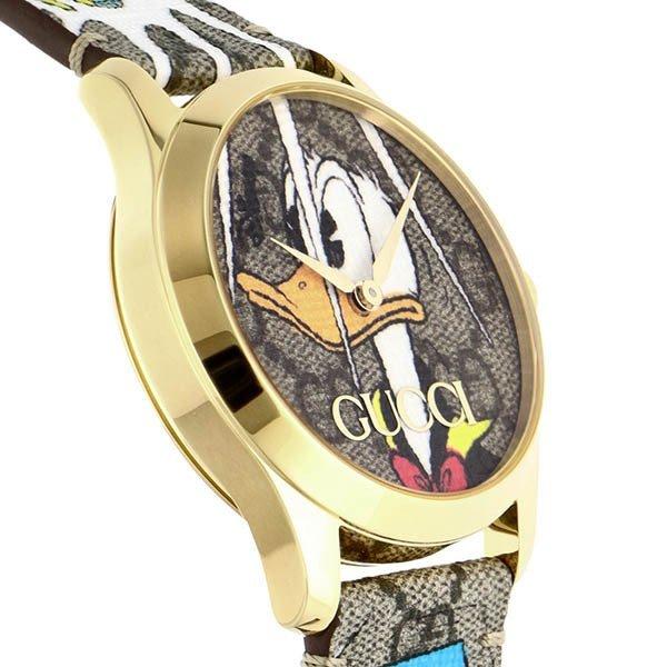 Side profile of Gucci G Timeless YA1264167 showing gold-tone case and strap edge