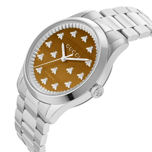 GUCCI G-Timeless 38MM watch on wrist showing brown dial with white bee hour markers and stainless steel case