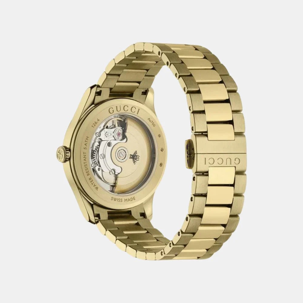 Gucci G-Timeless gold watch side view showing skeleton caseback and bracelet