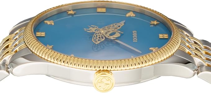 Side angle view of Gucci G-Timeless watch showing two-tone case, bezel, and blue dial