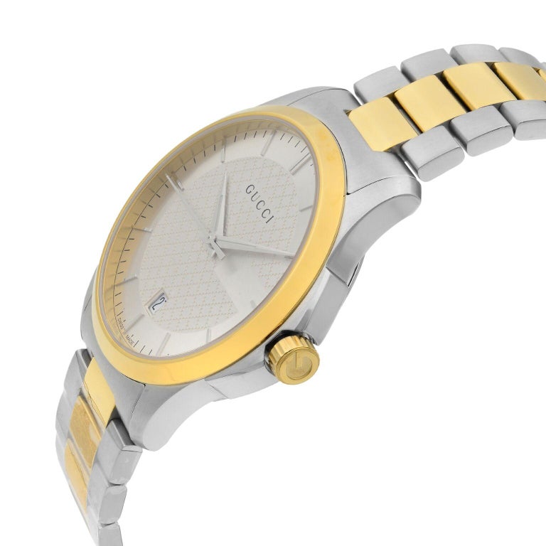 Gucci G-Timeless 38mm two tone watch shown at angle with gold and steel bracelet detail