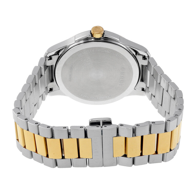 Caseback view of Gucci G-Timeless watch with engraved details and two tone mixed metal bracelet