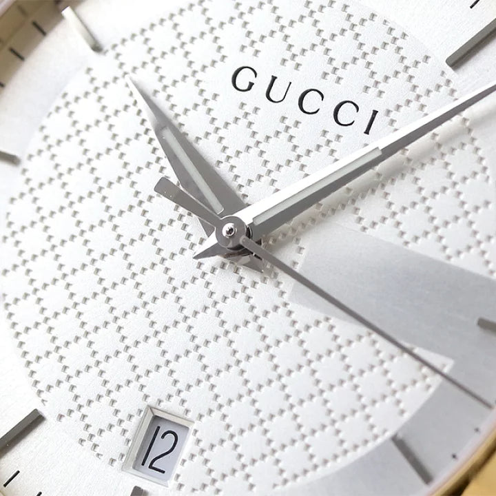 Close-up detail of Gucci G-Timeless dial showing quilted pattern and hour markers