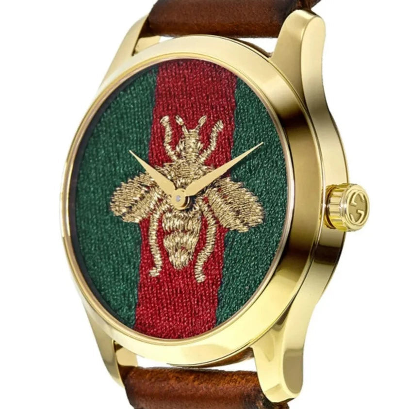 Gucci G Timeless honey bee watch front view with gold case and brown leather strap