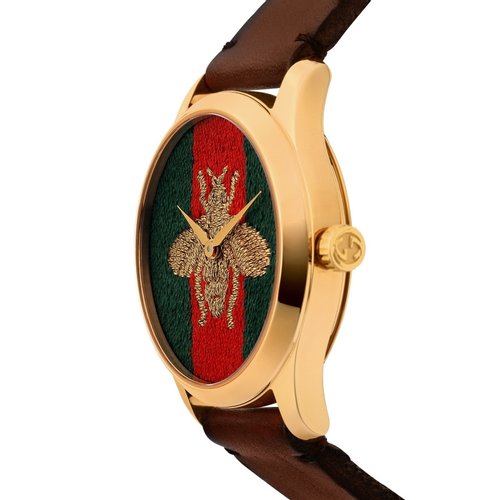 Gucci G Timeless watch side profile showing gold case thickness and brown leather strap