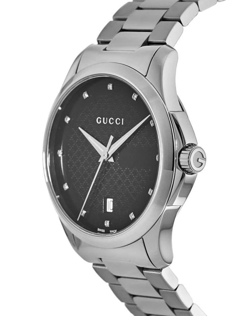 Side profile of Gucci G-Timeless showing case, bracelet, and crown detail
