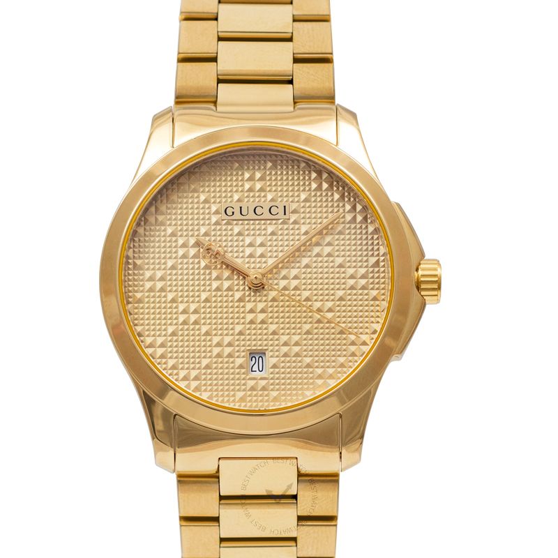 Gucci G-Timeless yellow gold watch front view with diamond pattern dial and date window