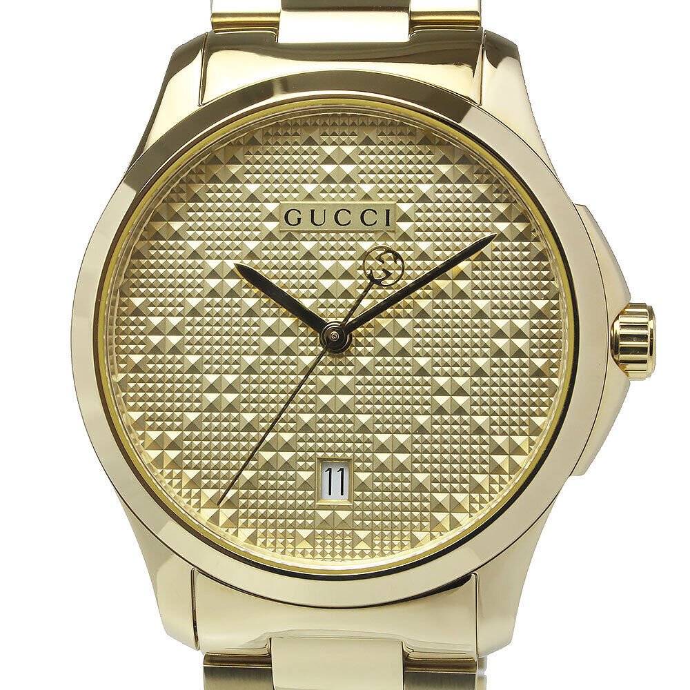 Gucci G-Timeless yellow gold watch showing geometric diamond pattern dial and bezel