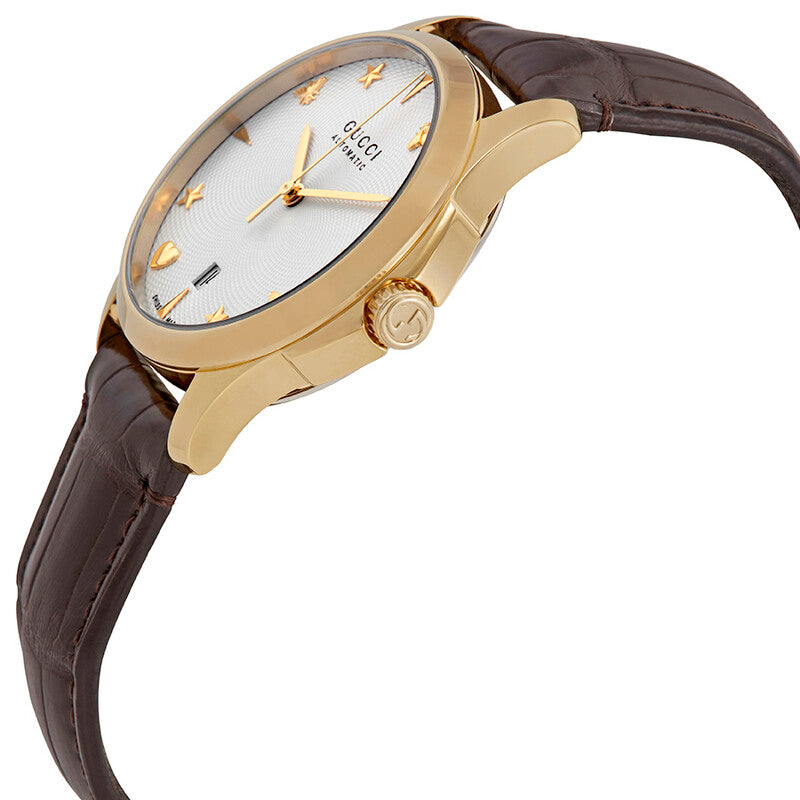 Side angle view of Gucci G-Timeless automatic watch showing gold case and brown leather strap