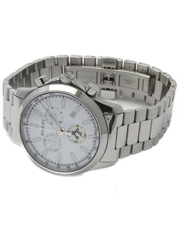 Gucci G-Timeless 38mm chronograph watch with silver dial on wrist with steel bracelet