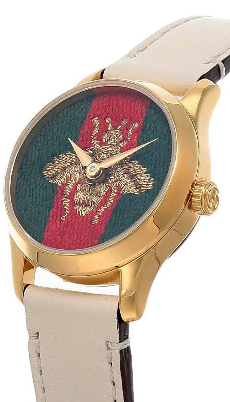 Gucci G-Timeless watch angled view with gold case and bee embroidery