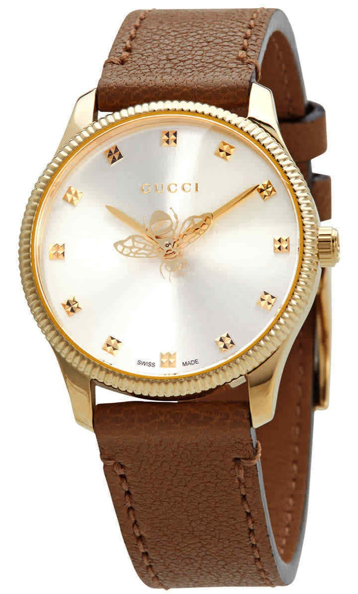 Gucci G-Timeless quartz watch with silver dial, gold-tone case, bee emblem, and brown leather strap