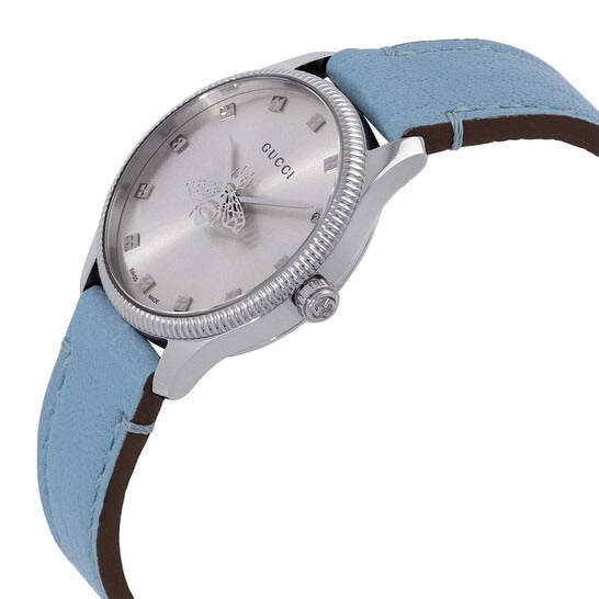 G-Timeless watch angled view showing silver dial and blue leather strap detail