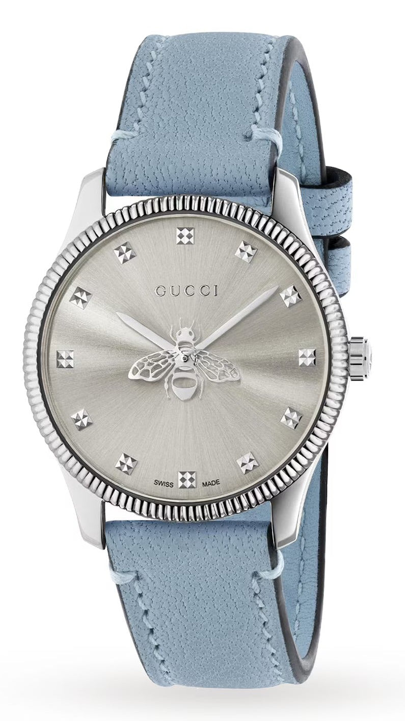 Gucci G-Timeless stainless steel watch with silver dial and blue leather strap