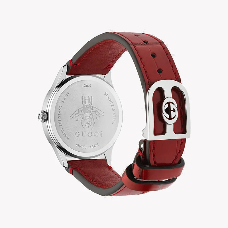Caseback of Gucci G-Timeless showing Swiss Made marking and bee engraving with red strap