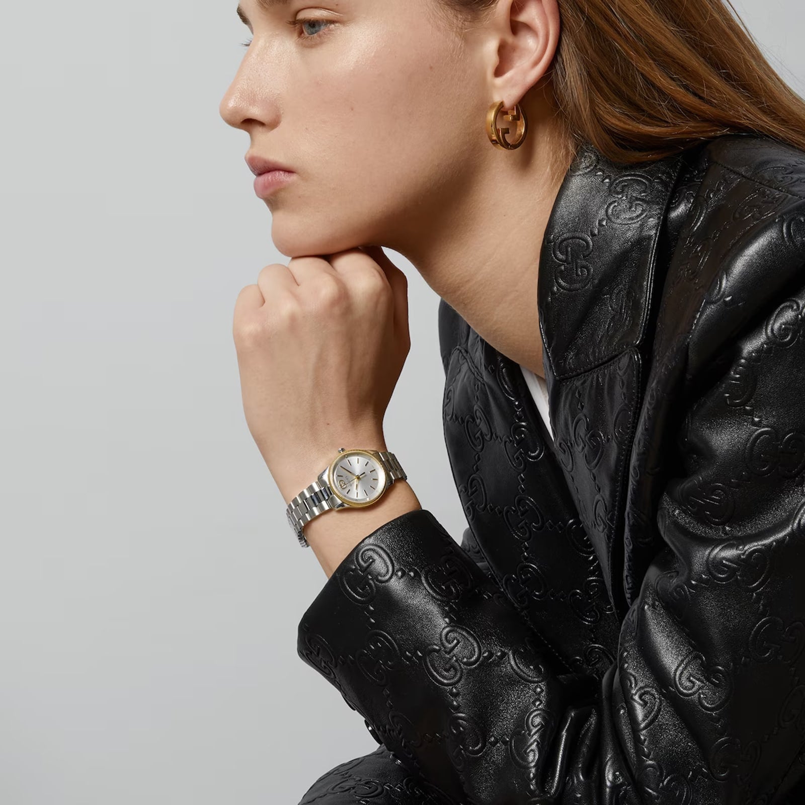 GUCCI G-Timeless 29MM watch worn on wrist, two-tone stainless steel and gold-tone bracelet