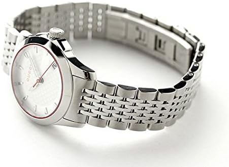 Gucci G Timeless watch worn on wrist, showing stainless steel bracelet detail