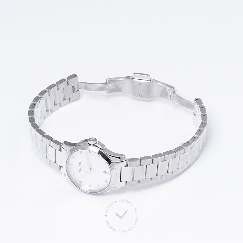 G-Timeless 27mm watch worn on wrist, showing steel bracelet and round dial