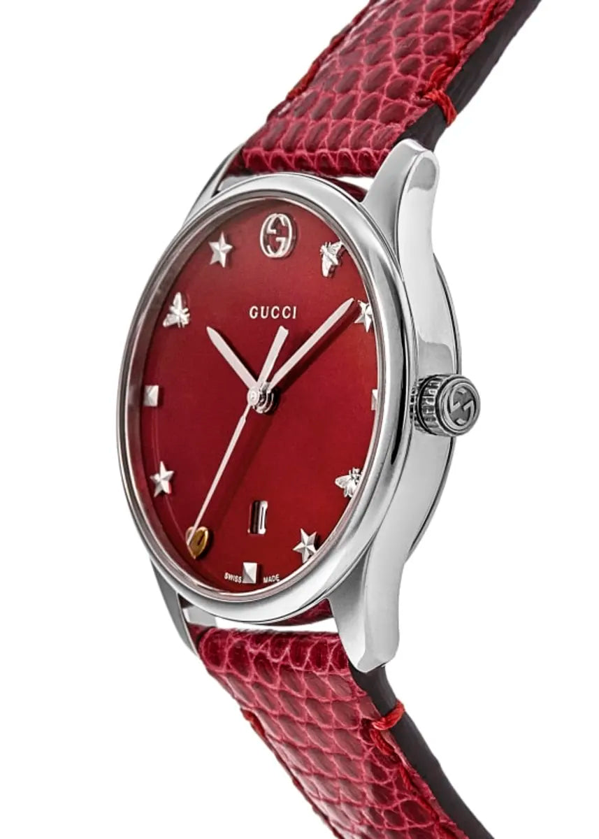 Side angle view of Gucci G-Timeless watch showing stainless steel case and red leather strap