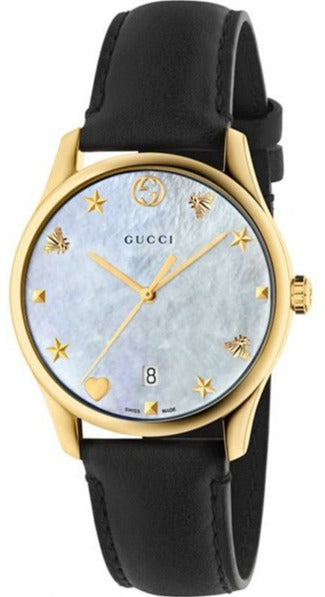 Gucci G-Timeless women's watch with mother of pearl dial, gold case, and black leather strap