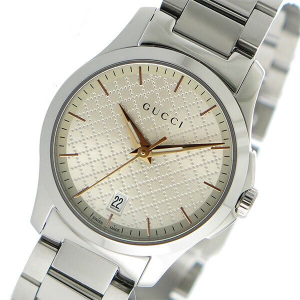 Angled view of Gucci G Timeless 27mm watch with champagne dial and G logo crown