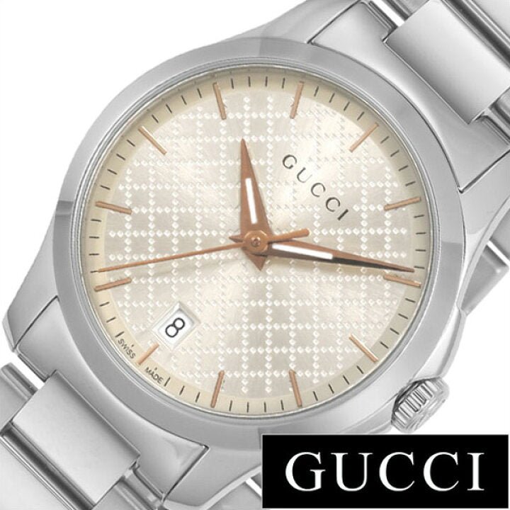 Close-up of Gucci G Timeless dial showing champagne color with diamond pattern texture