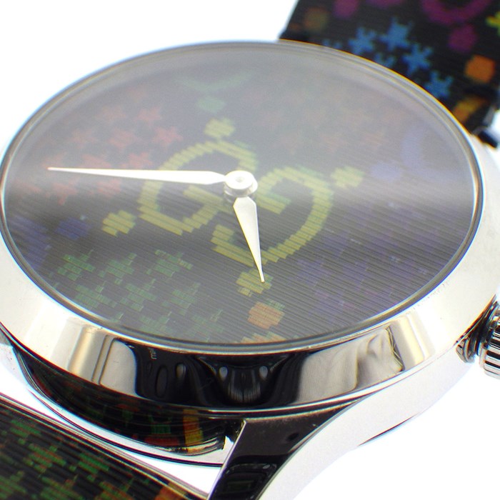 Detailed close-up of Gucci GG Psychedelic dial showing neon GG logo and multicolor pattern