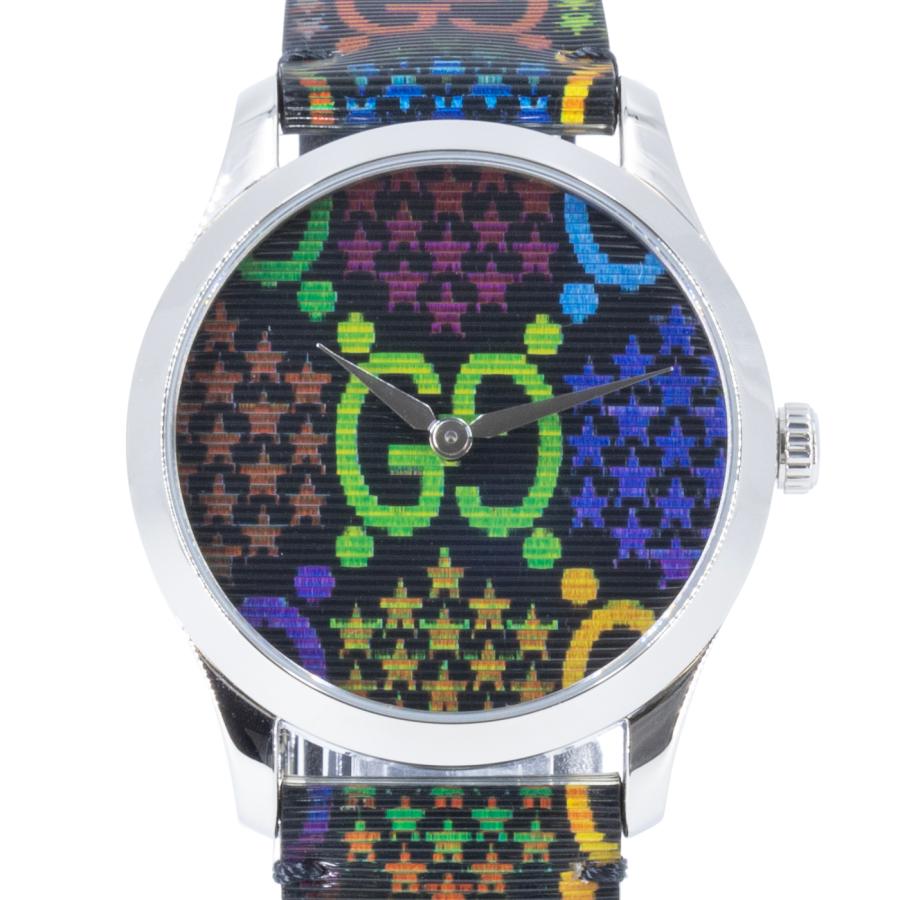Close-up front view of Gucci GG Psychedelic dial with neon logo and multicolor pattern