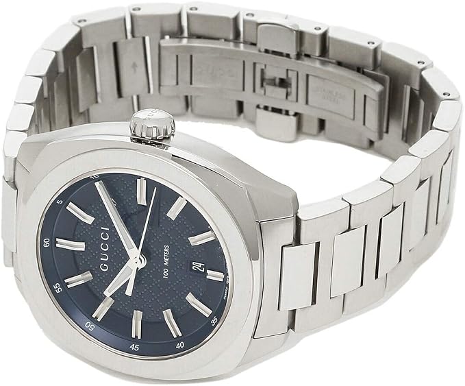 Gucci GG2570 men's watch worn on wrist with blue dial and stainless steel bracelet